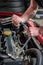 Car mechanic in auto repair service, starting