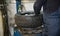 A car mechanic changes a tire on a wheel