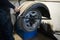 A car mechanic changes a tire on a wheel