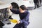 Car mechanic with a checklist, Technician checking modern car at garage, Car repair and maintenance concepts