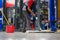 Car mechanic cleaning the garage floor at the auto industry shop workshop Use a mop to clean water from the epoxy floor in the car