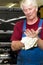 Car mechanic, cleaning his hands