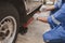 Car mechanic is inspecting tires and replacing worn tires through long hours of work, car repairs, car breakdowns, punctured tires