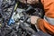 A car mechanic inspects a car faults and makes repairs in a car repair shop