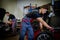 Car mechanic mounts tire on wheel in a workshop