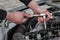 Car mechanic repair injectors of modern diesel engine