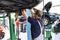 Car mechanic in the workshop changes the brakes of the vehicle