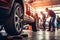 Car mechanics changing tire at auto repair shop garage. Generative AI