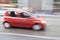 Car in motion blur, car driving fast in city