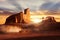 Car in motion in the Dasht-e Lut Desert against sunset. Beautiful rays under the rocks. Iran.