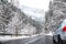 Car in the mountain serpentine in winter