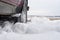 Car with mounted snow chains in wintry environment