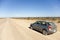 Car on an open dusty road