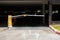 Car park barrier, automatic entry system.Security system for building access - barrier gate stop with toll booth, traffic cones an