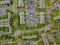 Car park in parking of aerial view suburban street of middle class suburban neighborhood with houses