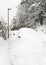 Car parked covered by a meter of snow, in the winter blizzard.