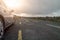 Car parked off small country road. Burren area, Ireland. Travel and tourism concept. Transportation