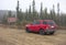 A car parked during a snow shower at a remote location in alaska