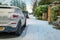 Car parked on winter snow road in town in england uk during covid lockdown