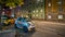 Car Parking In Front Of A Colorful Commercial Building