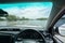 Car parking on a Huge flood highway. white car driving on a flooded road with yellow Road line