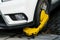 A car parks on forbidden parking lot, being wheel clamp lock