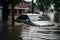 a car partially submerged in water on a flooded street