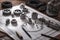 car parts on a wooden table with blueprint and tools, close up, Engineering and technician drawings and designs on table, AI