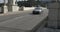 Car passing along an old ornate concrete bridge