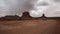 Car passing Monument Valley