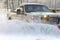 Car pickup cleaned from snow by a snowplough during wintertime