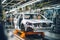 Car production line. Assembling a car on a conveyor belt. Close-up of a car body. Automotive industry Interior of a high-tech