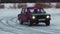 Car racing. Clip. Winter cold with snow and drifting Russian models of cars sliding on ice against the blue sky.