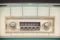 Car radio inside a green classic American car with chrome dashboard