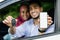 Car Rental App. Muslim Couple Showing Key And Smartphone With Blank Screen