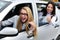 Car rental: women driving a car