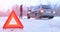 Car repair on the road in winter. Car triangle on winter road. Problem with vehicle on snowy road. Broken cars concept. banner of