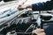 Car Repairman is Checking Engine Oil Level in Automotive Workshop, Maintenance Car Worker Inspection Checkup Oil Vehicle Engines