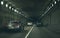 Car rides through the tunnel point-of-view driving. Driving-motion blur tunnel light. Interior of a tunnel with traffic