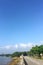 Car road, lake, tree, cloud and blue sky