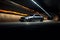 Car on the road in the tunnel at night. 3d rendering, A striking image of a car parked in a tunnel, AI Generated