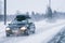 Car with roof rack and winter snowy road Rovaniemi EU