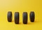 Car rubber tyres on a yellow background