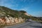 Car running fast on a curved dangerous mountain road