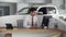 Car salesman sitting in showroom