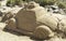 Car sand sculpture on the beach of Maspalomas