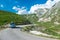 Car on scenic mountain road, which is highest road pass in Montenegro. Durmitor National Park. Adventure road trip