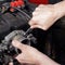 Car service - Engine repair mechanic hand with  wrench