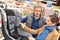 Car shop salesman selling child seat to client