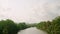 Car side window view of green coconut palm tree forest, rice terrace farming plantation. Train, road trip background on